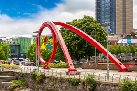 NEWPORT, UK - JUNE 30, 2022: Newport embankment of the river Usk and sculpture "The Wave" in a summer day in Newport, Wales, UKのeditorial素材