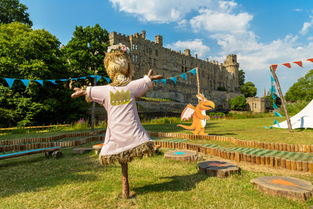 WARWICK, UK - JUNE 11, 2022: Scarecrow in Warwick Castle - is a medieval castle built by William the Conqueror in 1068 in a sunny summer day, UKのeditorial素材