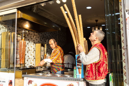 ISTANBUL, TURKEY - APRIL 10, 2022: Traditional turkish ice cream seller in Istanbul in a summer day