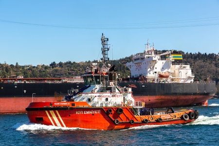ISTANBUL, TURKEY - APRIL 10, 2022: Coastal Safety boat against Crude Oil Tanker in Bosphorus in...