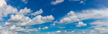 Panorama of Beautiful sky with clouds background in a sunny summer dayの写真素材
