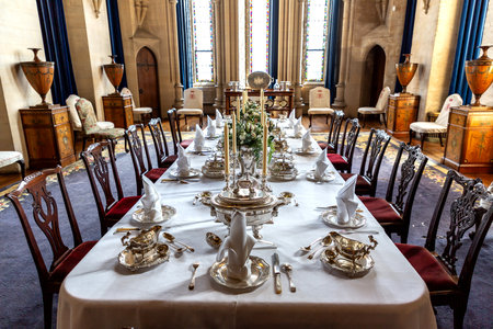 ARUNDEL, THE UNITED KINGDOM - SEPTEMBER 9, 2023: Interior of Arundel Castle - Vintage dining room in Arundel, England, United Kingdomのeditorial素材