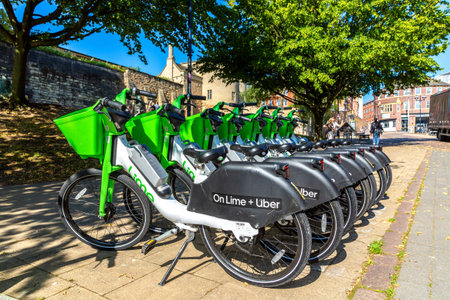 NOTTINGHAM, UK - SEPTEMBER 5, 2023: Cycle hire at a docking station by Lime in Nottingham in a sunny...