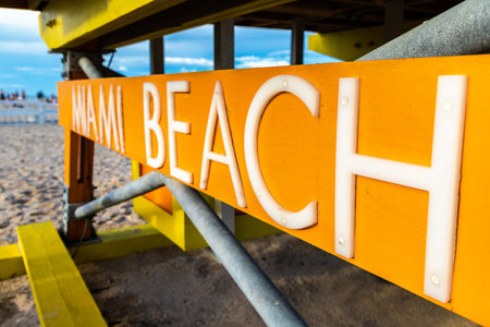 Close-up of Miami Beach sign on Lifeguard tower in South beach, Miami Beach in a sunny day, Floridaの写真素材