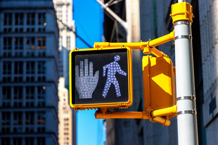 White "Walk sign" pedestrian traffic light in New York City, NY, USAの写真素材