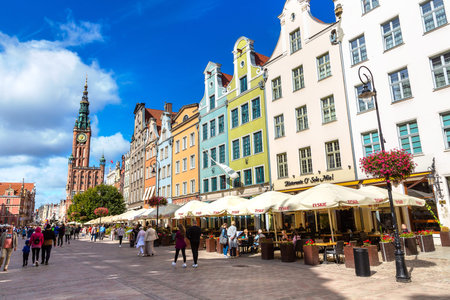 GDANSK, POLAND - SEPTEMBER 7, 2022: Street in an Old town and Town Hall in Gdansk, Poland