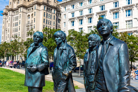 LIVERPOOL, UK - AUGUST 16, 2023: The Beatles Statue in Liverpool stands at the Pier Head on the side...