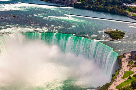 Panoramic aerial view of Canadian side view of Niagara Falls, Horseshoe Falls in a sunny day  in Niagara Falls, Ontario, Canadaの写真素材