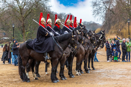 LONDON, UK â JANUARY 31, 2025: Household Cavalry soldiers on horseback at Horse Guards Parade during the Changing of the Kingâs Life Guard. This daily event is part of British military traditionのeditorial素材