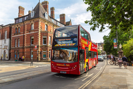 YORK, UK - JUNE 26, 2025: Tourist red open top double decker sightseeing bus on city street in York, North Yorkshire, England, United Kingdomのeditorial素材