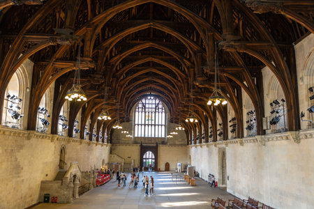 LONDON, UK - AUGUST 12, 2024: Interior of medieval Westminster Hall with wooden ceiling and stained...