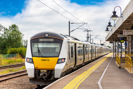 British Rail Class 700 Siemens Desiro City train at Ely railway station in Cambridgeshire, England, United Kingdomのeditorial素材