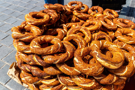 Street turkish vendor sells Simits - Traditional turkish bagels in Istanbul, Turkey in a sunny day