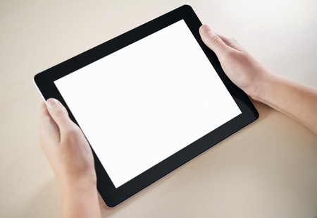 Woman hands holding electronic tablet pc with blank screen.の写真素材