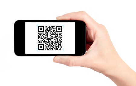 Hand holding mobile smart phone with QR code scanner on the screen. Isolated on white.の写真素材