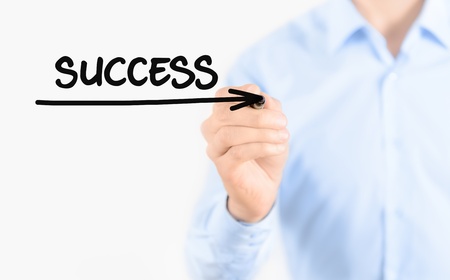 Young businessman drawing succes concept  Isolated on white の写真素材