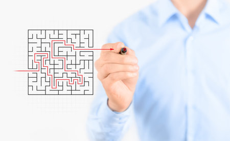 Young businessman drawing success way to find solution concept  Isolated on white の写真素材