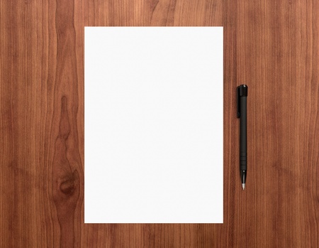 Blank white paper with pen on a wooden desk  High quality graphic collage の写真素材