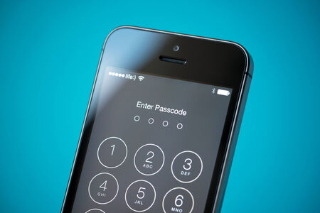 Kiev, Ukraine - September 24, 2014: Close-up shot of brand new Apple iPhone 5S showing four digits passcode security system to prevent unauthorized access.のeditorial素材