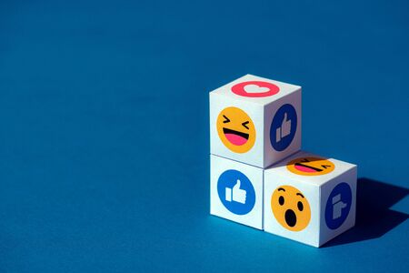 Kyiv, Ukraine - September 9, 2019: A paper cubes with printed emojis from Facebook Messenger, one of the biggest and world-famous social network.のeditorial素材
