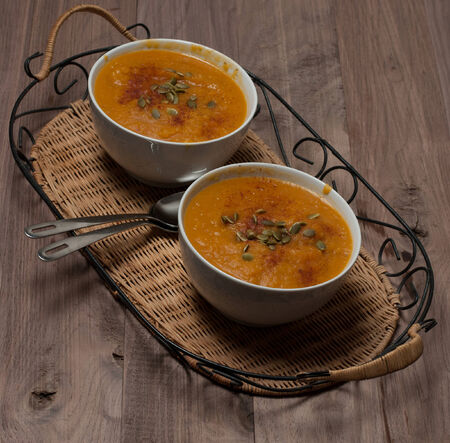 Pumkin Soup with Seeds and Paprika on Vintage Trayの写真素材