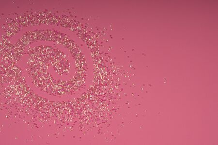 Pearl Confettis on Coral Background. Shiny Pearl Pieces Laying on Coral Background. Party Fun Banner.の写真素材