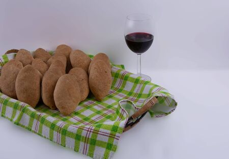 Homemade Stuffed Pies Ready to Be Served with Glass of Wine.の写真素材