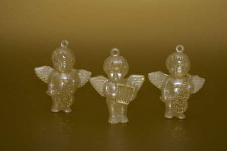 Angels play music on golden backgroundの写真素材