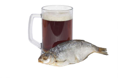 Cold dark beer glass and fish isolated on white backgroundの写真素材