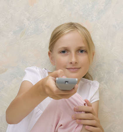 Teenager girl with remote controlの写真素材