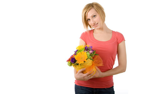 Portrait of a beautiful young woman with spring flowers