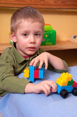 boy with plastic blocksの写真素材