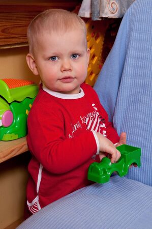  young boy with green carの写真素材