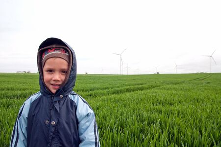 the boy on wind farmの写真素材