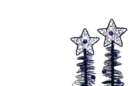 Two metal wire christmas trees with big star on top and peals attached isolated on white backgroundの写真素材