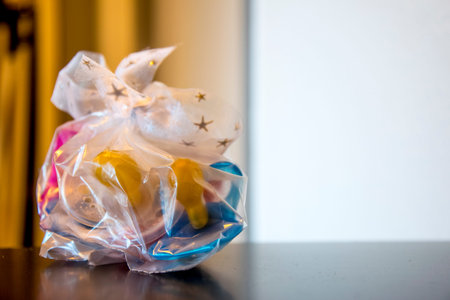 A bag of pacifiers wrapped with a pretty bow with starsの写真素材