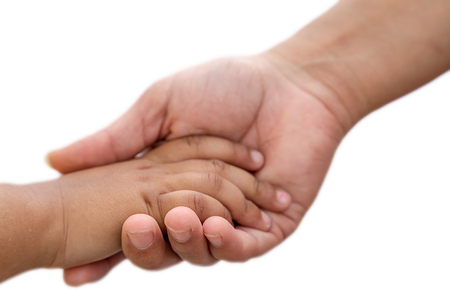 Mother's hand holding baby hand on white isolated backgroundの写真素材