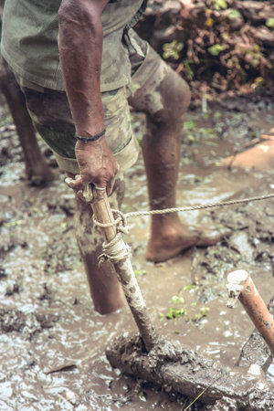 Indian farmer ploughing his fields.