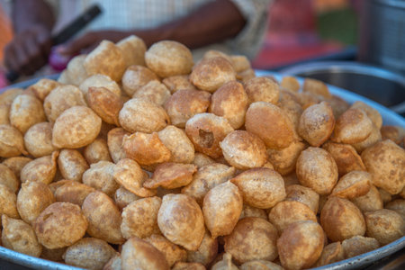 Famous Indian street food gol gappe or pani puri. Chat item Selling in Indian market