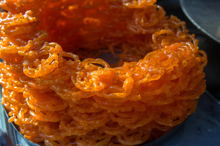 Close up view of Jalebi. very sweet Indian sweetie with syrup fried out in oilの写真素材