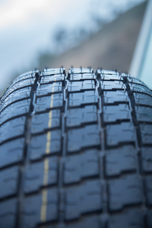 New car tyre closeup photo. With detail