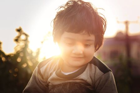 Close up head shot portrait of young little 2 or 3 years old baby girl smiling happy and cheerful in joy face expression.の写真素材