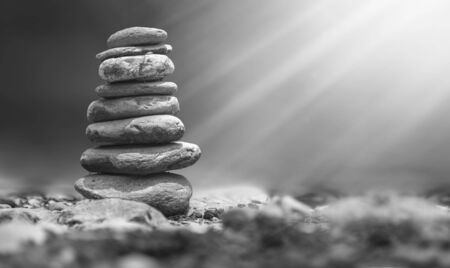 River stones Balanced on the Rock. Pyramid of river stones on of one anotherの写真素材
