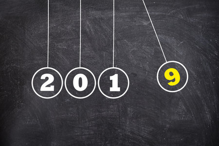 New Year 2020 Newtons Cradle on Chalkboard, new year concept