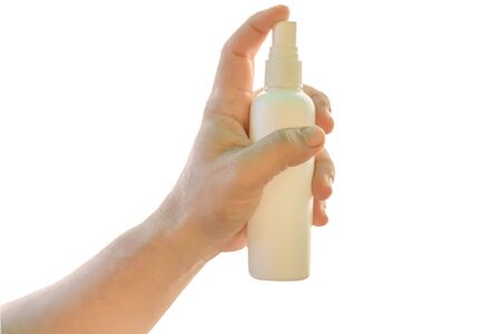 Close up of hand holding white alcohol sanitizer gel bottle for protect safety infection and kill Novel Coronavirus (2019-nCoV) Covid-19 virus, bacteria and germs isolated on white background.の写真素材