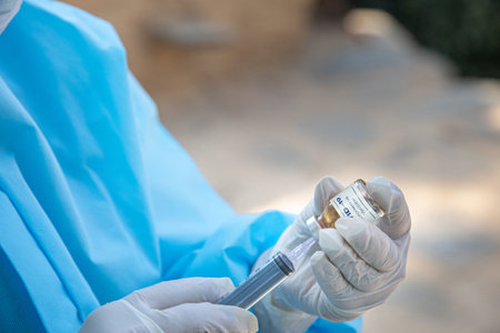 vaccine in doctor hands, female doctor holds syringe and bottle with vaccine for  cure. Concept of ...