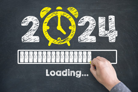 Human Hand Drawing New Year Concepts 2024 Countdown Clock on Chalkboard Backgroundの写真素材