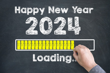 Close up of Human hand Drawing Innovation Technology Loading New Year 2024 on Blackboard Backgroundの写真素材