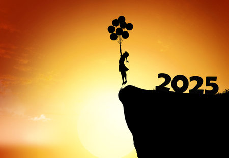 A silhouette of a girl holding balloons leaps off a cliff into a vibrant sunset, symbolizing joy and new beginnings for 2025.の写真素材