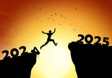 Man jumping on cliff 2025 over the precipice with stones at amazing sunset. New Year's concept. 2024 falls into the abyss. Welcome 2025. People enters the year 2025, creative idea.の写真素材